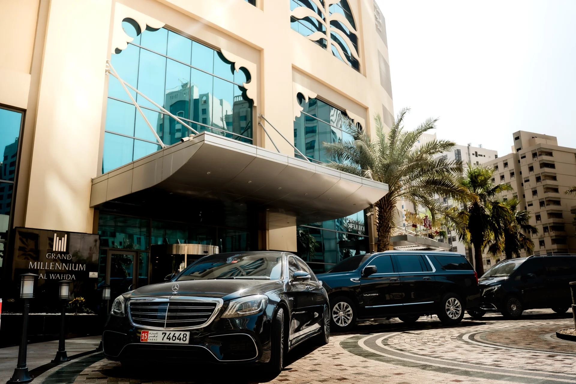 GuardianGO premium vehicle fleet outside a hotel